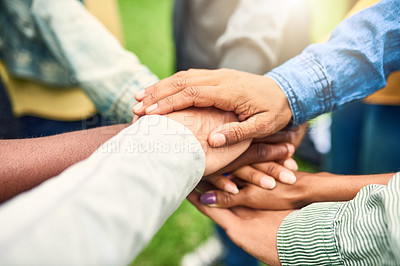 Buy stock photo Cropped shot of a group of people joining their hands together