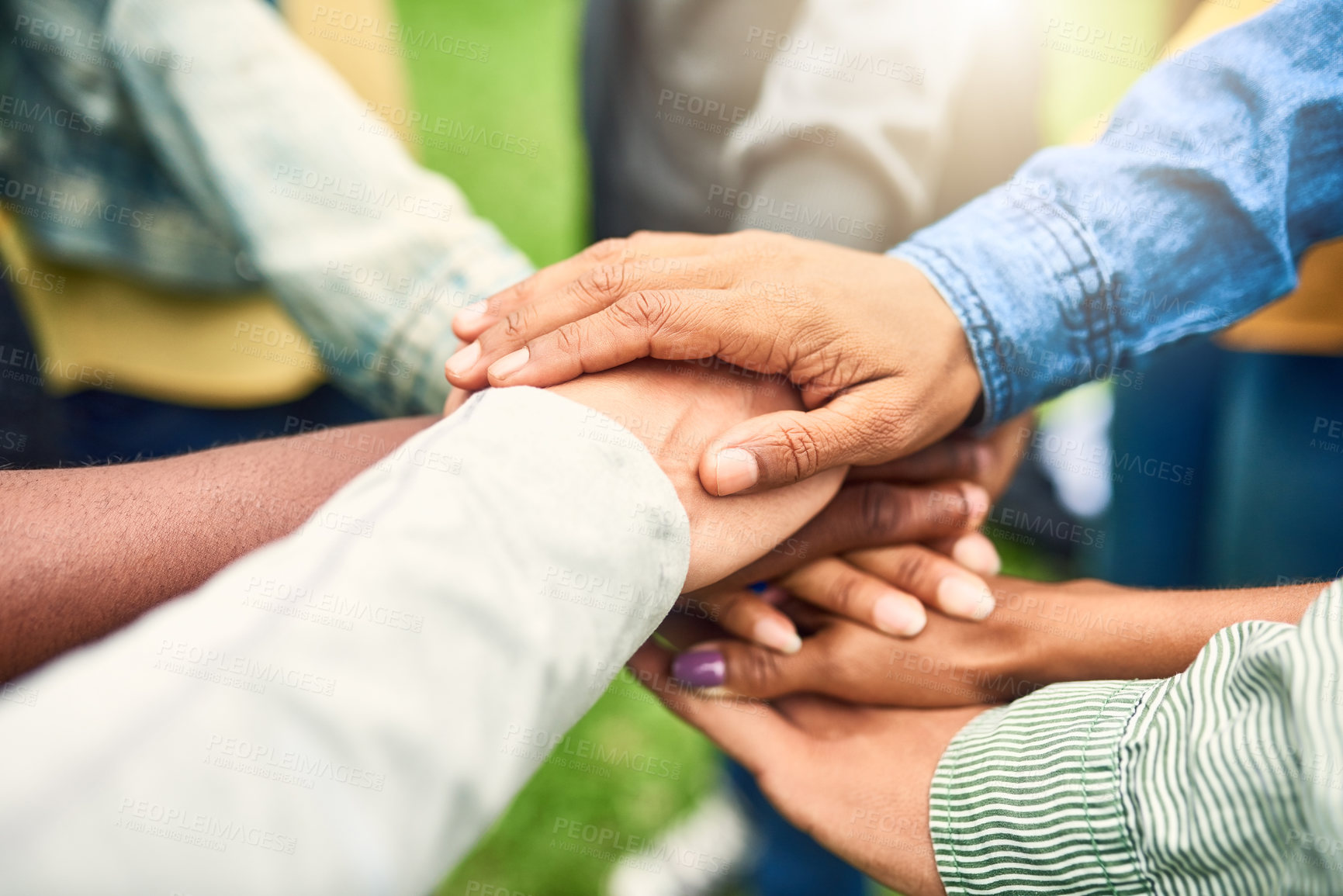Buy stock photo Cropped shot of a group of people joining their hands together