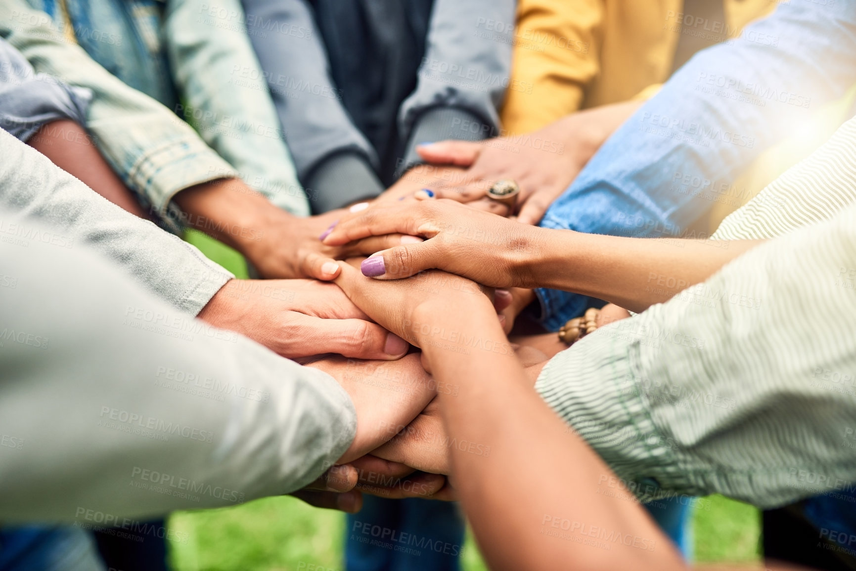 Buy stock photo Friends, community and stack of hands of people for motivation, support and friendship goal outdoor. Teamwork, diversity and men and woman huddle together for trust, commitment and solidarity in park