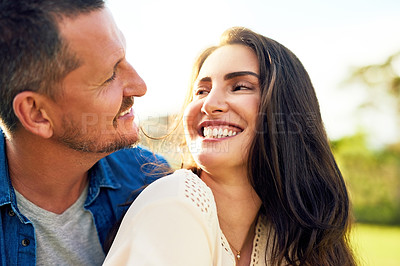 Buy stock photo Shot of a happy couple bonding together outdoors