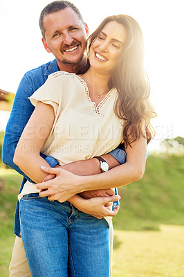 Buy stock photo Couple, relax and bonding with hug, outdoor and portrait in nature, smile and happy for commitment. Embrace, joy and holding hands in summer, love and trust of partner, man and woman in park and USA