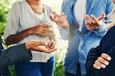 Buy stock photo Closeup shot of a group of unrecognizable businesspeople having a discussion outdoors