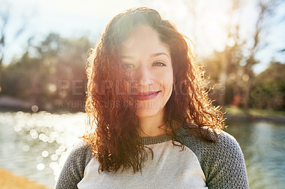 Buy stock photo Portrait of a beautiful young woman standing next to a lake