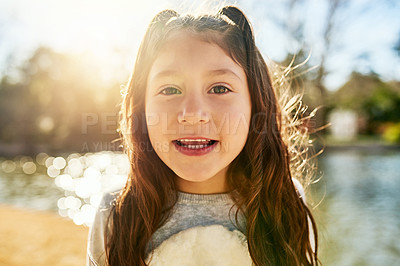 Buy stock photo Portrait of an adorable little girl next to a lake