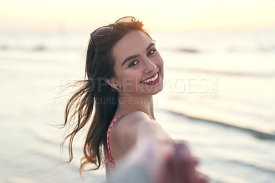 Buy stock photo POV shot of a beautiful young woman holding her best friends hand at the beach