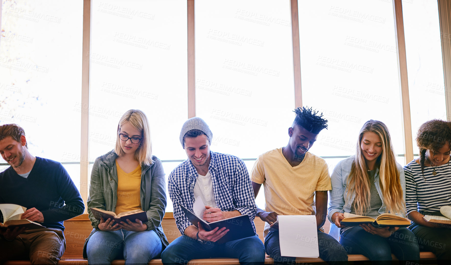 Buy stock photo Shot of a group of university students studying at campus
