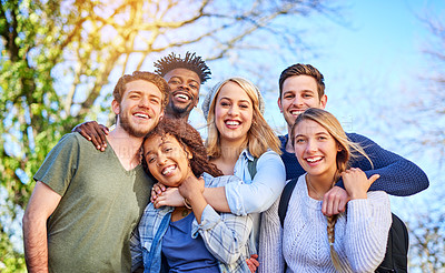 Buy stock photo Portrait of a group of diverse students hanging out together outside on campus