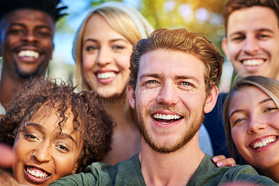 Buy stock photo Portrait of a group of students hanging out together outside on campus