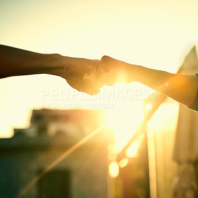 Buy stock photo Cropped shot of two men fist bumping outdoors