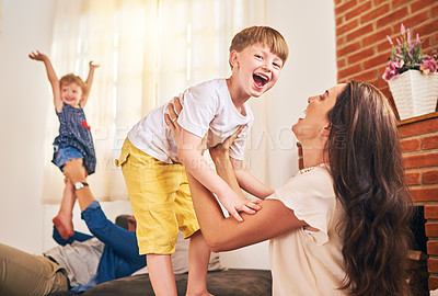Buy stock photo Portrait of a happy young family enjoying playtime together at home