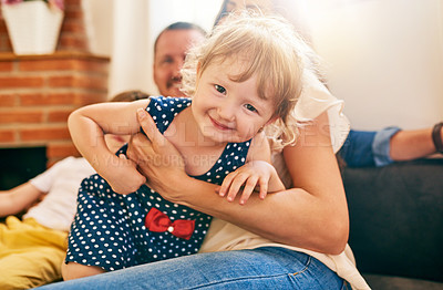 Buy stock photo Portrait, happy family and mother hug kid in home for bonding together, love and support. Smile, mom and embrace child in living room for connection, youth development and foster girl with parents