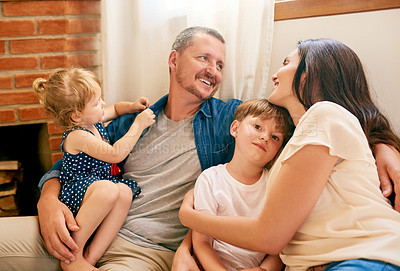 Buy stock photo Portrait of a happy young family spending quality time at home