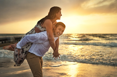 Buy stock photo Couple, portrait and sunset at beach, piggyback and together on vacation for relationship connection. People, ocean and support for affection in nature, peace and honeymoon date on tropical island