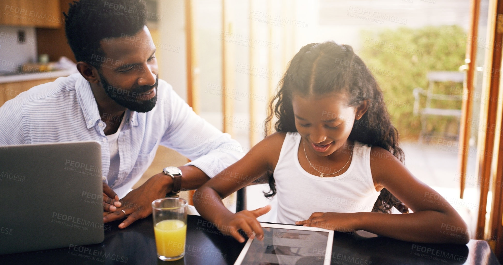 Buy stock photo Cropped shot of a young father and his adorable daughter using a tablet at home