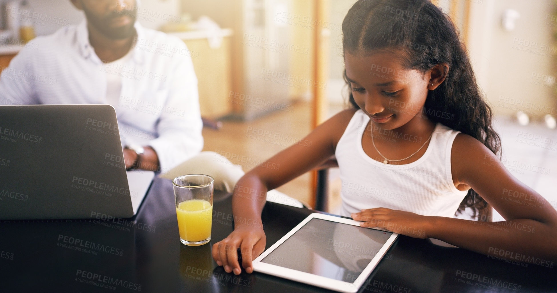 Buy stock photo Cropped shot of a young father and his adorable daughter using a tablet at home