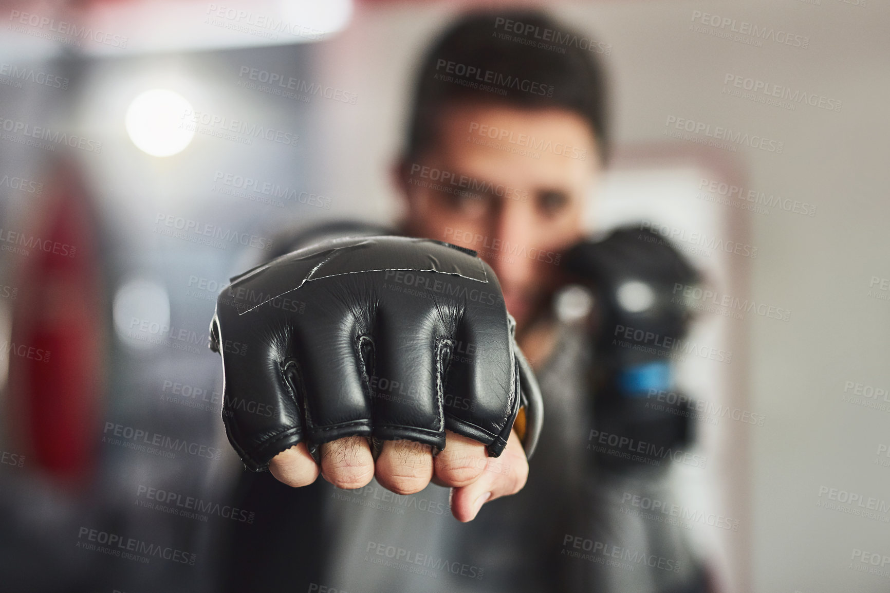 Buy stock photo Cropped portrait of a professional fighter training in the gym