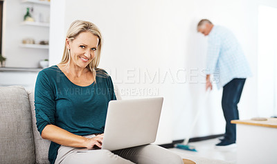 Buy stock photo Mature, woman and sofa portrait with laptop, browsing and internet search or social media break in living room. Man, sweeping for house maintenance, married couple and weekend together in apartment