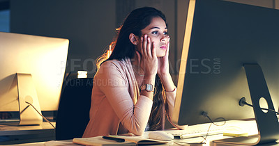 Buy stock photo Cropped shot of a beautiful young woman working at night in a modern office