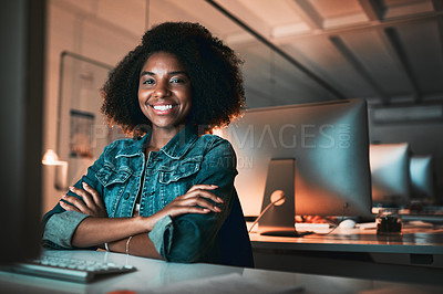 Buy stock photo Cropped portrait of an attractive young female designer looking confident while working on her computer in the office