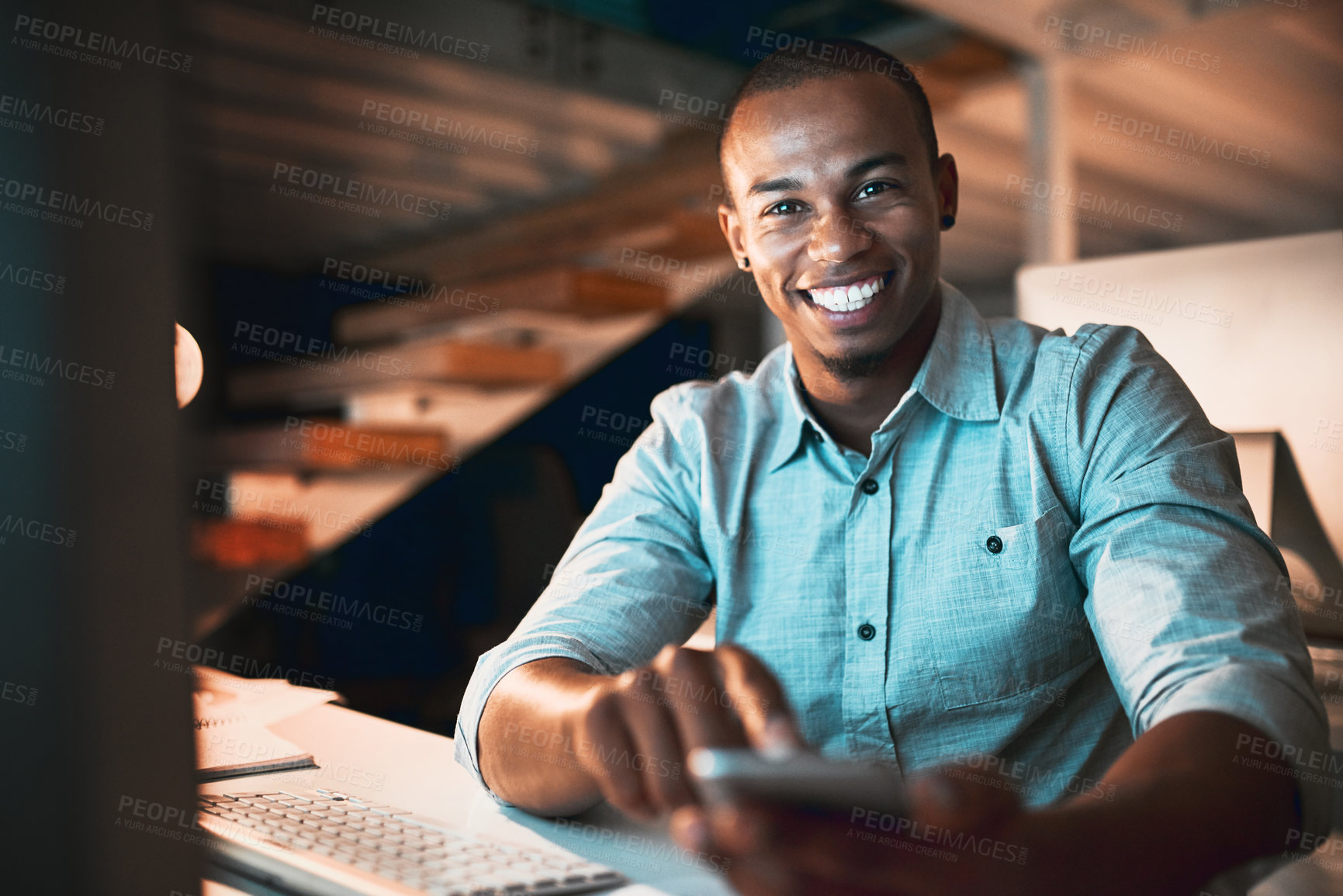 Buy stock photo Night, phone and black man in office for portrait, connectivity and excited for opportunity. Mobile, smile or web designer at tech for creative project, market research or positive feedback in Brazil