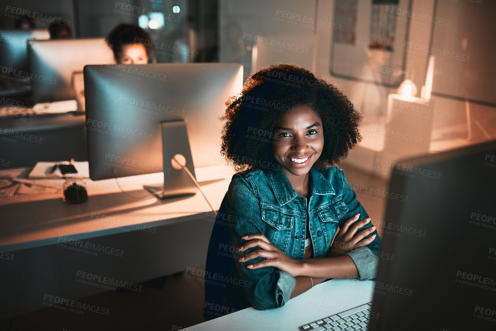 Buy stock photo High angle portrait of an attractive young female designer looking confident while working on her computer in the office