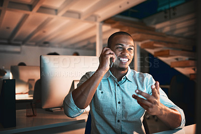 Buy stock photo Cropped shot of handsome young male designer making a phonecall while working in the office