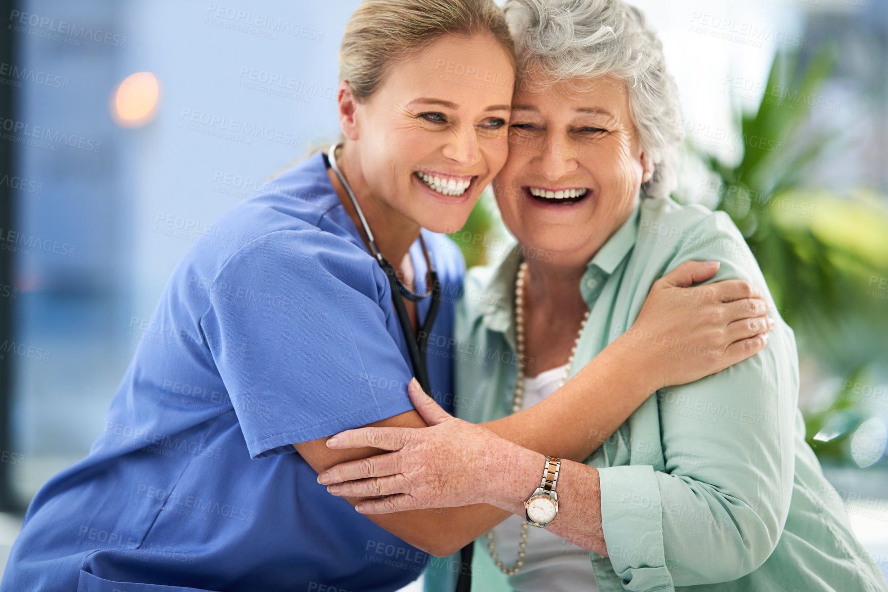 Buy stock photo Nurse laugh, senior woman and hug of caregiver and happy smile with support and care in hospital. Wellness, women and healthcare employee help with elderly female patient with love in a clinic