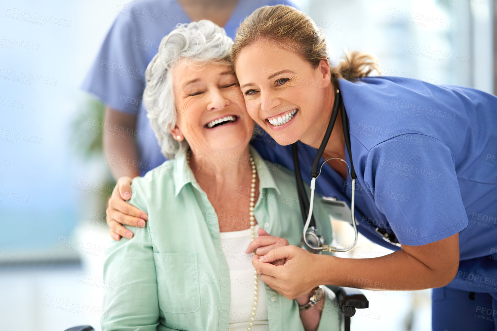 Buy stock photo Nurse, senior woman and hug of caregiver and happy smile with support and care in hospital. Wheelchair, women and healthcare employee help with elderly female patient with love in a health clinic
