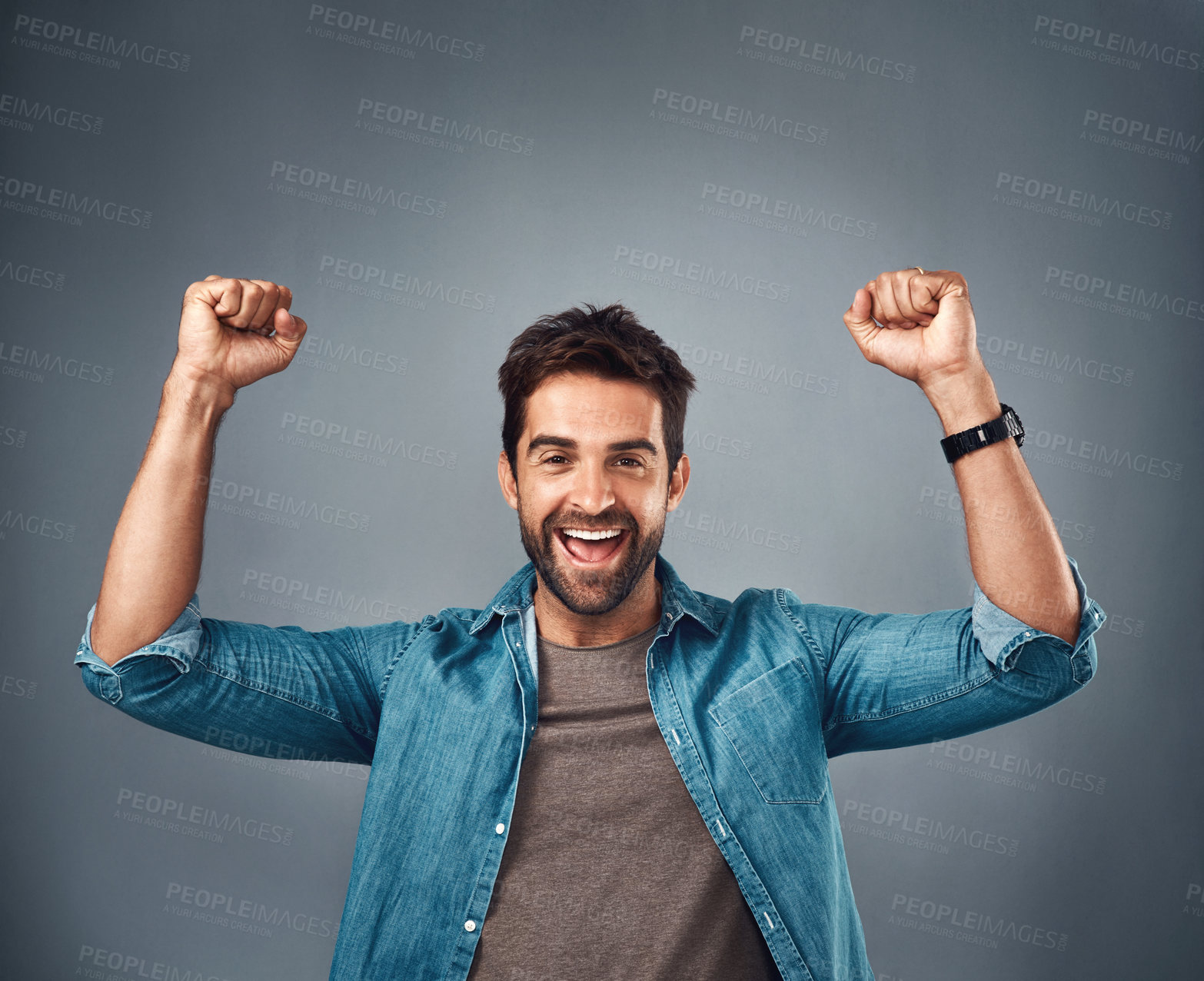 Buy stock photo Happy man, fist and celebration for winning, achievement or success against a grey studio background. Excited portrait of male person or winner in victory, win or accomplishment on mockup space