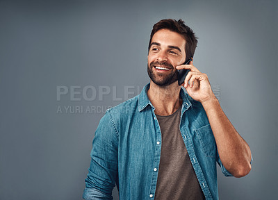 Buy stock photo Happy man, fashion and phone call in studio with style, cheerful on mobile in gray background. Male person, smile and outfit for confidence, retail or sale in communication for promo in denim shirt