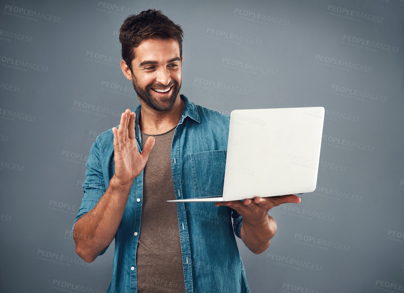 Buy stock photo Happy, businessman and wave at laptop for webinar, video call or virtual interview with communication in studio. Smile, male person or employee and computer for networking, online meeting or seminar