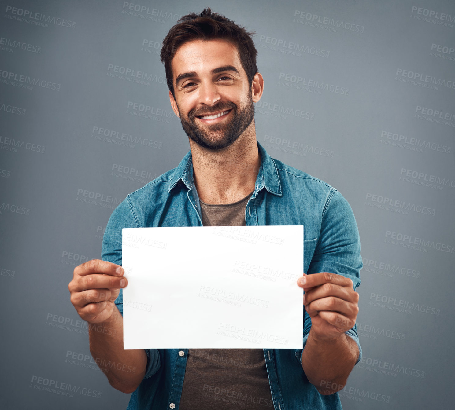 Buy stock photo Happy man, portrait and billboard on mockup for advertising, marketing or branding against a grey studio background. Male person holding rectangle poster or placard for sign, message or advertisement