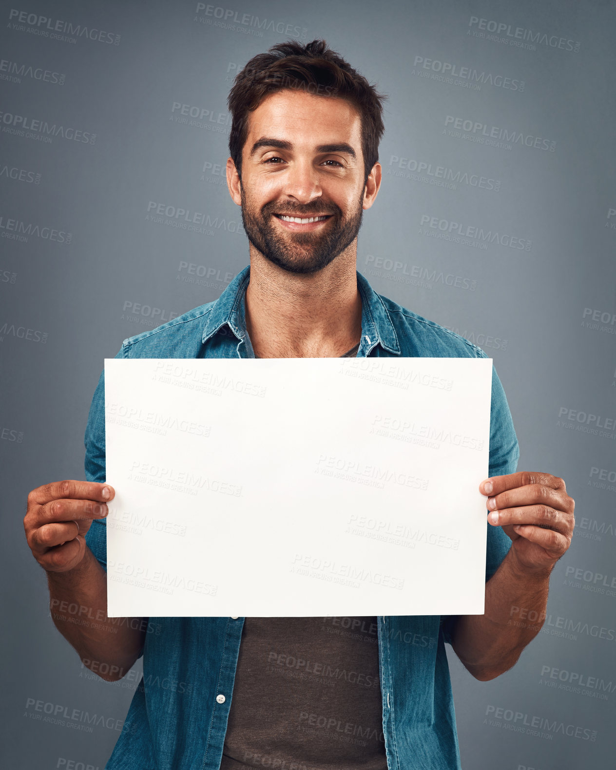 Buy stock photo Happy man, portrait and billboard on mockup for marketing, advertising or branding against a grey studio background. Male person holding rectangle poster or placard for sign, message or advertisement