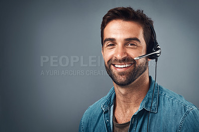 Buy stock photo Happy man, call center and headphones on mockup space for consulting against a grey studio background. Portrait of friendly male consultant agent with smile and headset in contact us or online advice