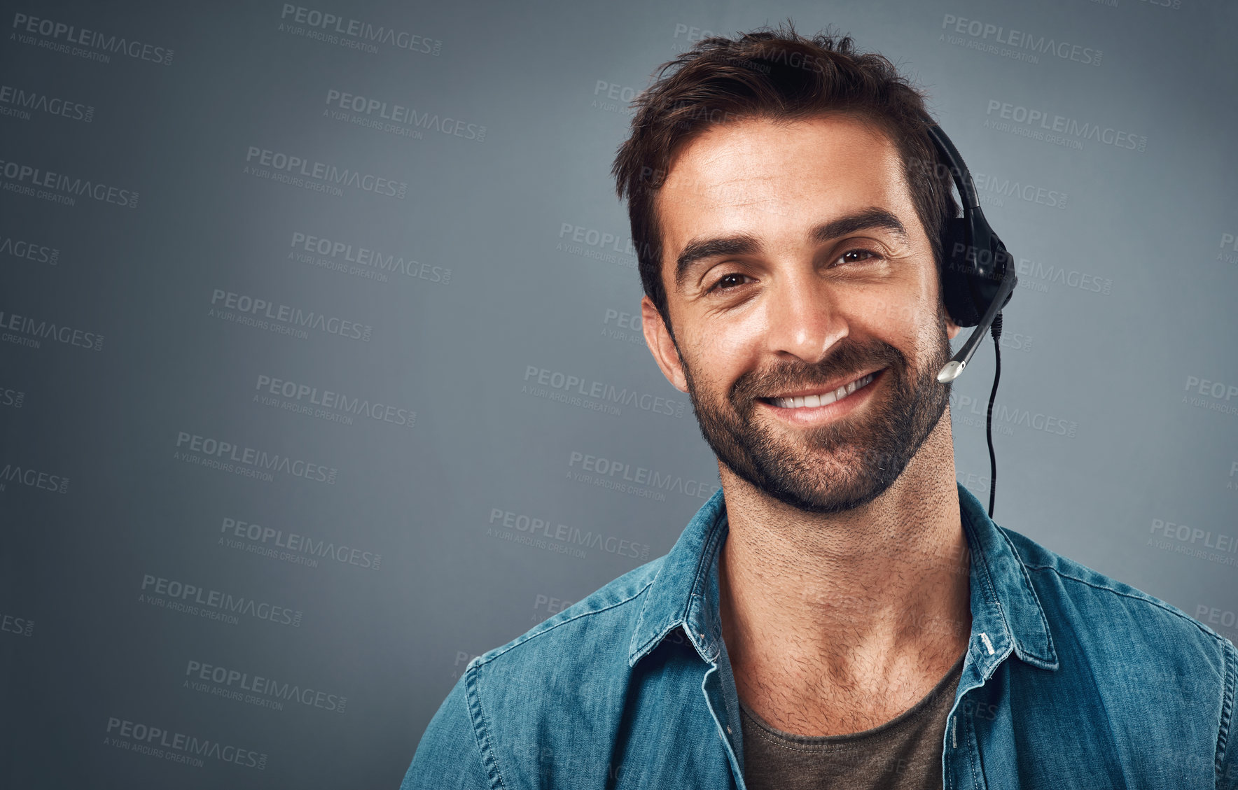 Buy stock photo Happy man, call center and headphones for consulting on mockup space against a grey studio background. Portrait of friendly male consultant agent with smile and headset in contact us or online advice