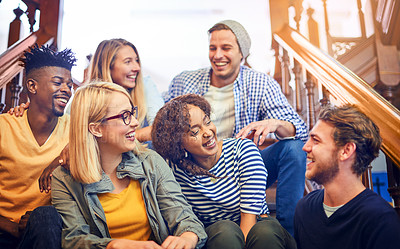 Buy stock photo Cropped shot of a group of diverse university students chilling on the staircase on campus