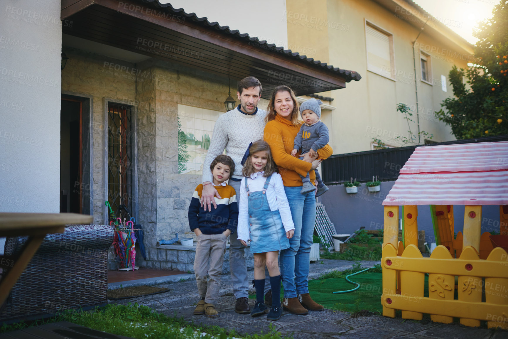 Buy stock photo Shot of a family of five standing in their backyard