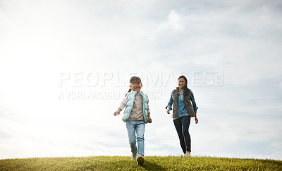 Buy stock photo Nature, walking and mother with kid in park on holiday, getaway or vacation in countryside for growth. Happy, space and mom with girl outdoor by grass with child development on weekend trip together.