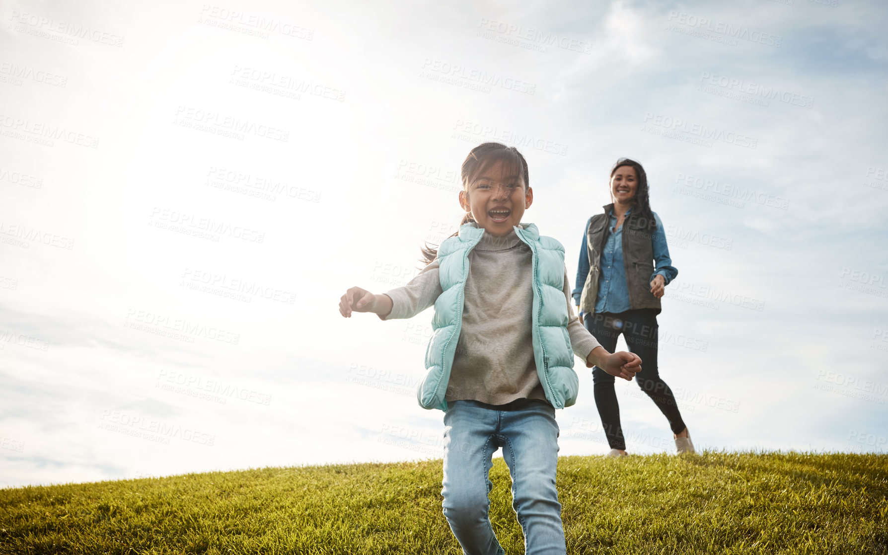 Buy stock photo Shot of an adorable little girl out for a walk with her mom