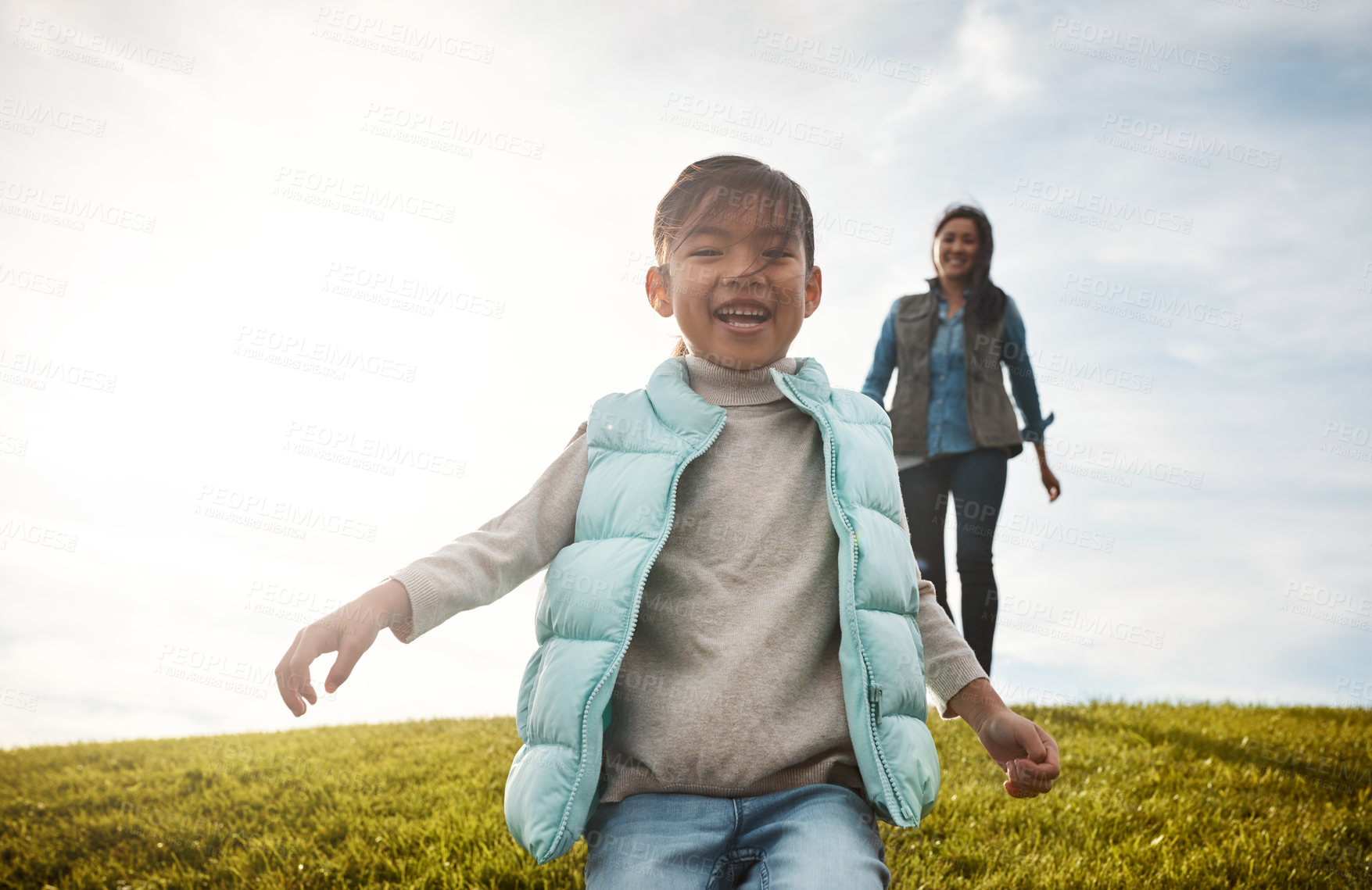 Buy stock photo Shot of an adorable little girl out for a walk with her mom