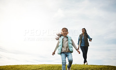 Buy stock photo Shot of an attractive young woman and her daughter in the park