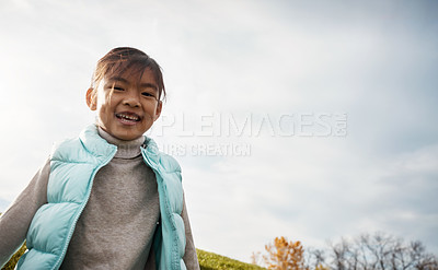 Buy stock photo Shot of an adorable little girl running around in the park