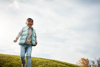 Buy stock photo Shot of an adorable little girl spending the day outdoors 