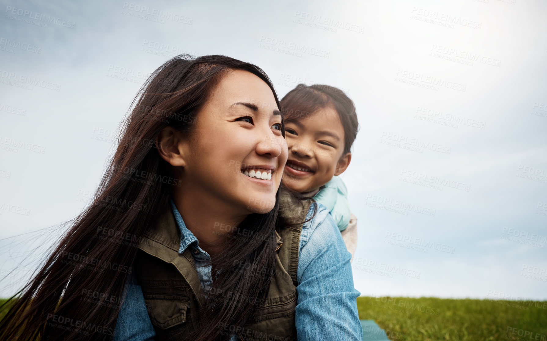 Buy stock photo Shot of a mother bonding with her little daughter outdoors