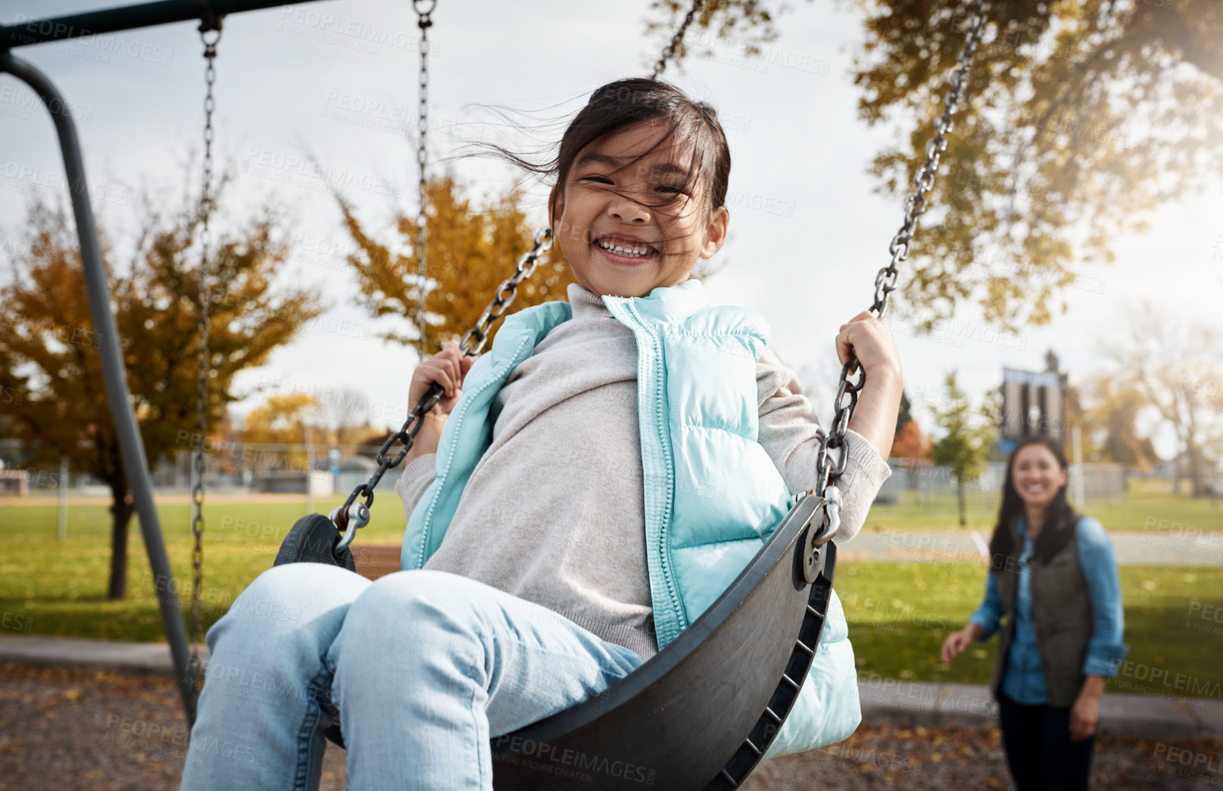 Buy stock photo Happy, mother or daughter in park on swing, having fun or bonding on winter break. Smile, playful and Asian people on playground with portrait, connection or emotional development on weekend together