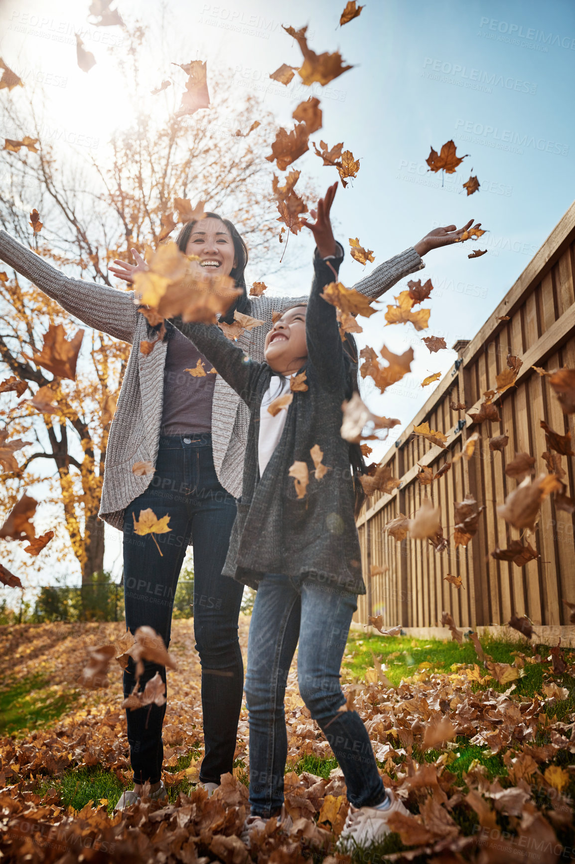 Buy stock photo Shot of an adorable little girl enjoying an autumn day outdoors