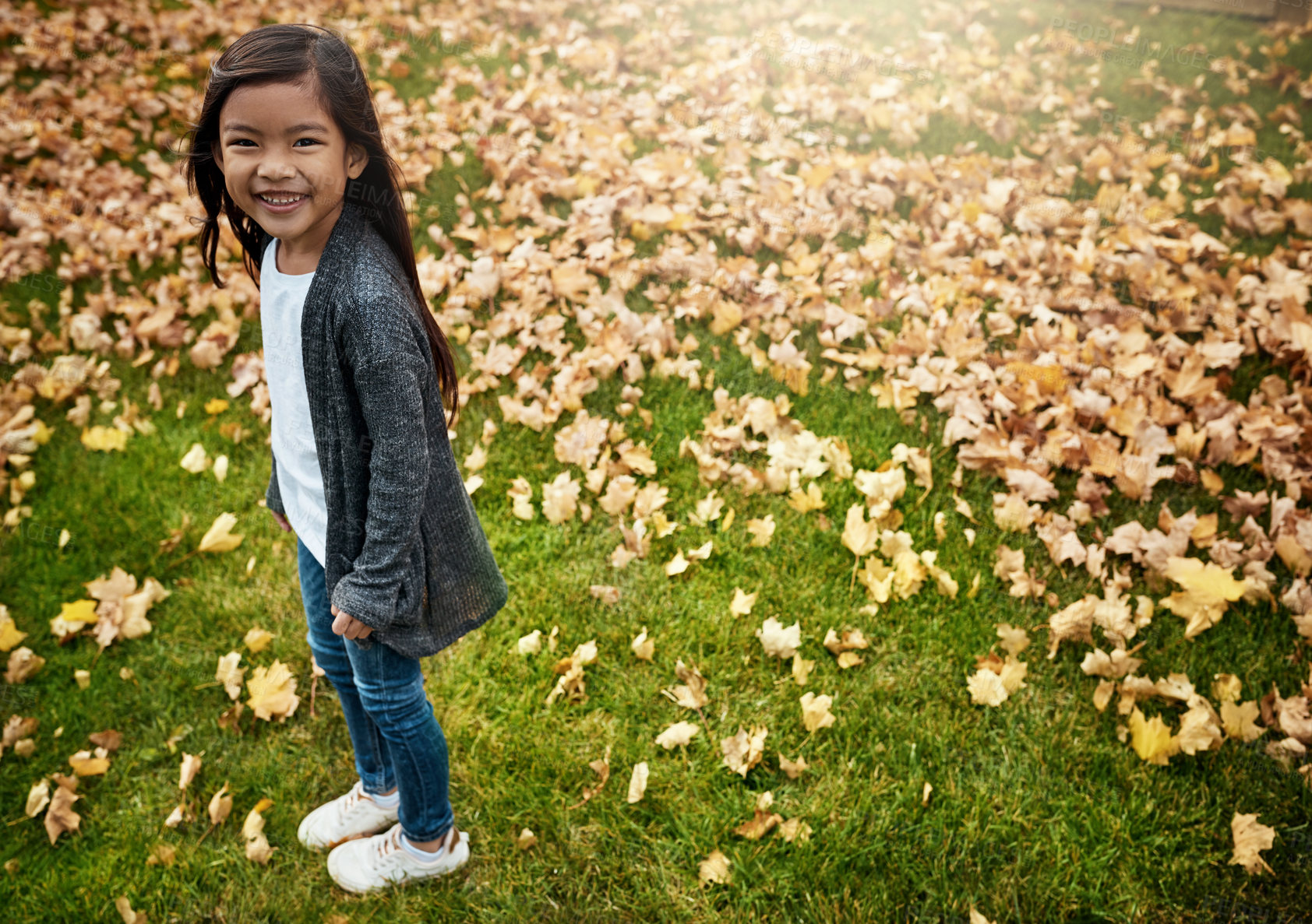 Buy stock photo Portrait of an adorable little girl enjoying an autumn day outdoors