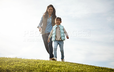 Buy stock photo Shot of an attractive young woman and her daughter in the park