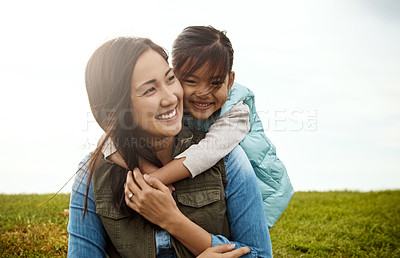 Buy stock photo Cropped shot of a little girl embracing her mother from behind