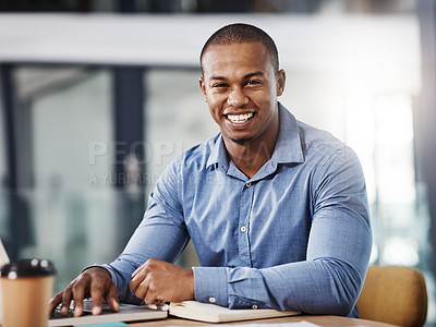 Buy stock photo Portrait of a handsome young businessman working in his office